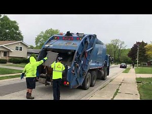 Allied Waste Mack LE Rear Loader Garbage Truck Packing Piles Of Bulk
