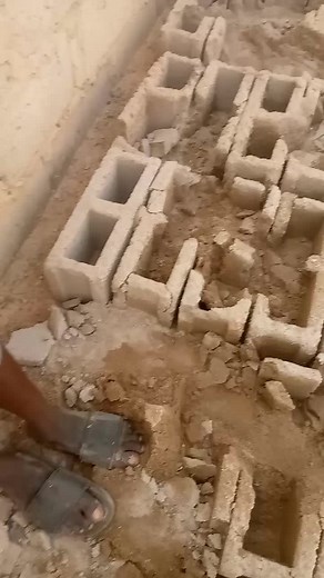 Walking on Freshly Laid Concrete Blocks at Construction Site