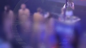 Moment clubbers strip NAKED on stage to win iPhone before police swoop in