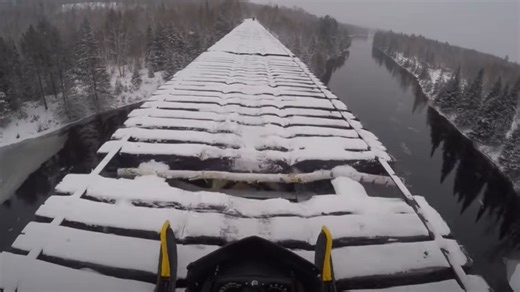 Snowmobile Crosses Sketchy Trestle Railroad Bridge