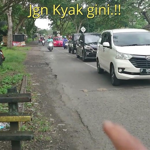Stop!! Don't do this. Follow road markings and officer instructions