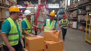 4K, Caucasian chief with hard helmet unacceptable crash broke cardboard box from workers, logistic problem in warehouse factory, senior worker scold staff about unaware carrying packing damaged boxes