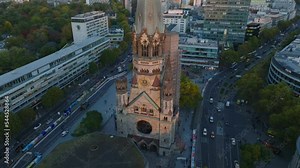 Elevated slide and pan footage of Kaiser Wilhelm Memorial Church. remains of old church after bombing in WWII. Charlottenburg neighbourhood, Berlin, Germany