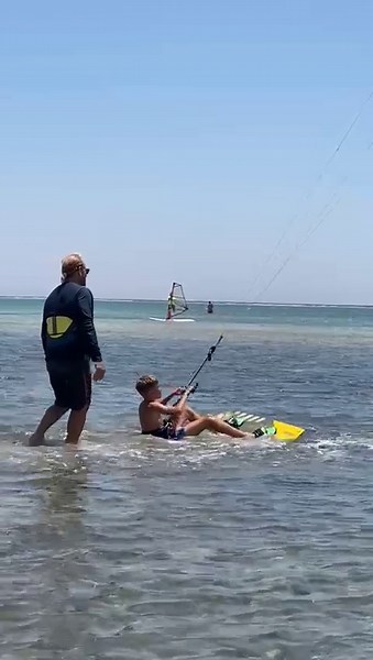 Water Sports Adventure: Parent and Child Kiteboarding