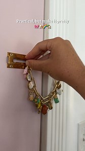 707K views · 24K reactions | I turned my security lock into a mini charm bracelet—because why not make everyday details feel special? These little clay charms were so fun to make, and now my door is just a little cuter (and still totally functional!).Would you add charms to your lock too? 立#diyclaycharms #securitylock #doorlockdecor #charmbraceletvibes #craftyhome #airdryclayprojects #aestheticsecurity | At Home with Ashley | Facebook