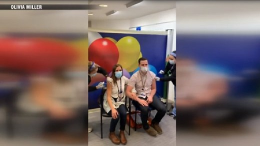 Hospital workers announce engagement while getting COVID-19 vaccine