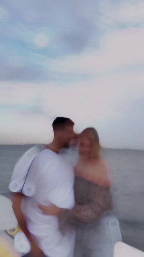 Romantic Couple Embracing on a Scenic Boat