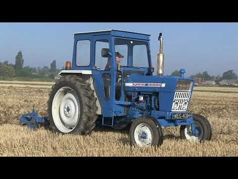 OLD TRACTORS AND CULTIVATORS AT WORK