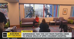 Superhero window washers spend Halloween rappelling down UPMC Children's Hospital