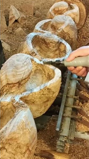 one of the processes of carving a tree trunk to make a tree decoration #wood