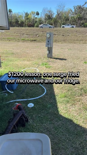 RV park power isn't always clean—and one bad hookup can cost you hundreds. This surge protector stops power spikes before they hit your rig. We never plug in without it now. RV Surge Protector, RV Life, Full Time RV, RV FDI Accessories, RV Upgrades, RV Gear, Protect Your Rig, RV Newbie, RV Tips, RV Essentials, Surge Protector, Camping Life, RV Hacks, RV Electrical #rvmusthaves #rvsurgeprotector #rvsafety #campermusthave #campersurgeprotector