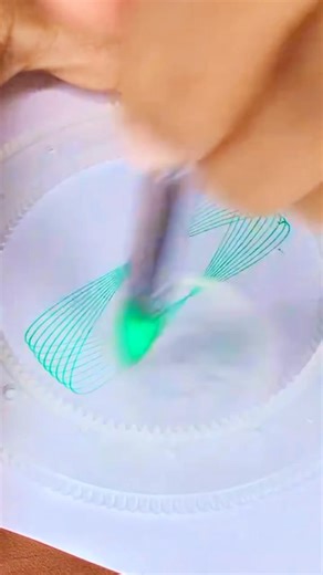 4.9K views · 30 reactions | Hypnotic Circle ⭕ Geometric Patterns in Play ✨#SpirographArt #GeometricPatterns #MathArt #CreativeExpression #HypnoticPatterns #OpticalIllusion #ArtLover #GeometryInMotion #ColorfulArt #ViralArt #artontheweb #usa  | Entertainment Hub | Facebook