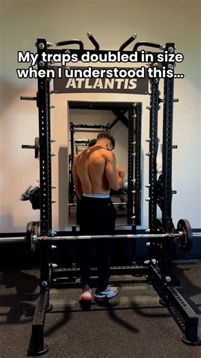 FreeYourMind™ on Instagram: "Most lifters think traps = one muscle. Truth is, they’re split into upper, middle, and lower sections, running all the way down your back. If you only shrug heavy from the side, you’re missing 2/3 of the muscle. That’s why variation matters. Barbell shrugs behind the back shift emphasis, while leaning slightly forward with the bar in front lights up the mid traps. Together, they build density across your whole upper back, not just height near the neck. Stop chasing w