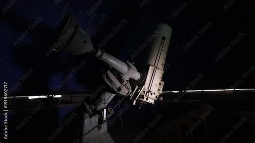 A slow upward pan reveals a large, rusted, and abandoned telescope inside a dark, decaying observatory dome. Sunlight peeks through a narrow opening in the deep blue ceiling.