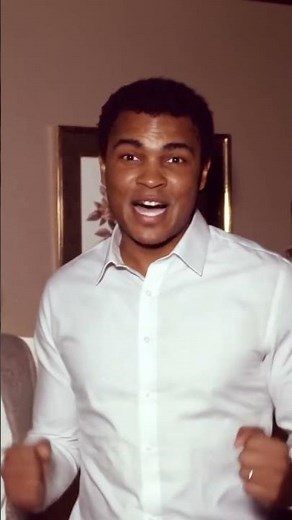 Mohammed Ali performs a quick, victory shuffle dance. the man on his right was interviewing him