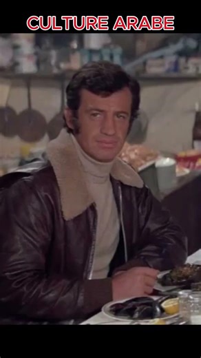 EGYPTIAN ACTOR OMAR SHARIF IN THE FILM THE BURGLARY - RESTAURANT SCENE WITH BELMONDO.