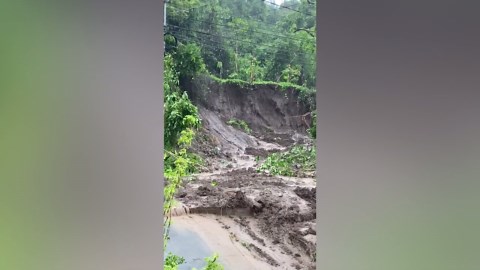 Landslide covers road in Tropical Storm Trami aftermath