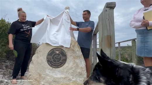 The unveiling of the plaque by Nauo co-chair Danielle James and Fishery Bay Surf Reserve committee member Matthew Trewartha. | ABC Eyre Peninsula