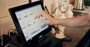 Close Up shot of manager swiping touch payment terminal as to service customer