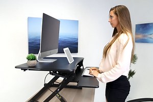 Get this highly-rated adjustable standing desk converter for over 25% off