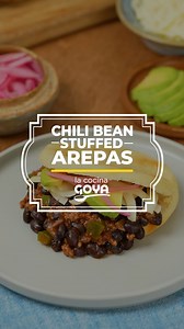 Bite into these delectable 🫓🌽 Sweet and Smoky Black Bean Chili Stuffed Arepas! Ideal for a hungry crowd, these maize flour cakes feature bold Latin flavors with a fusion of hearty chili taste and the traditional Latin cornmeal patties. Make them fresh at home with GOYA® Masarepa. Comment AREPAS to unlock the full recipe. | Goya Foods