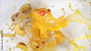 Super Slow Motion of Explosion Peach and Burst Juice and Slices