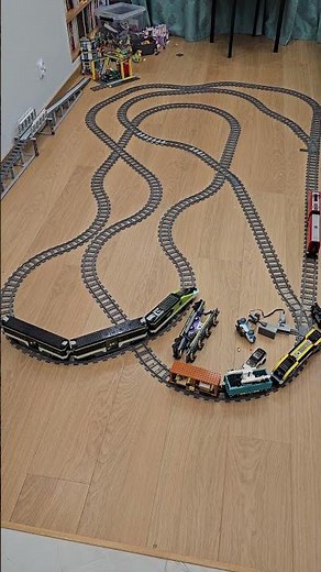 Three LEGO trains on a triple-connected layout end in a chaotic crash