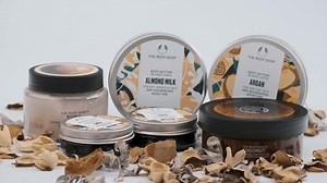 Tbilisi, Georgia - December 30 2023: Close up shot of Body Shop multi-purpose cosmetic set, face,body and hair, Set of different bottles of cream or serum on white background