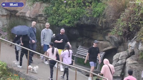 Sam Smith enjoys the Bondi to Bronte walk in the rain with friends