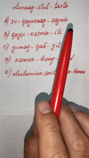 Writing in Cyrillic Script with a Red Pen