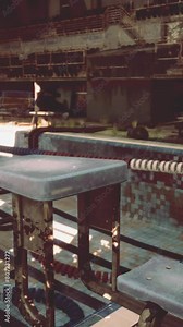 An empty swimming pool in a large building