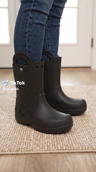 Don't let rainy days dampen your plans! 🌧️ Crocs Handle It Rain Boots. Designed to keep your feet dry with signature Crocs comfort, making wet weather walks a breeze. Easy to pull on. Tap to shop and get yours today! #rainboots #crocs #footwearfashion #AIGC #Moras