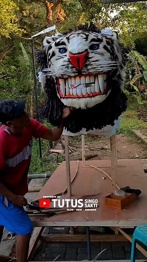 Intricate Tiger Head Sculpture Creation Process