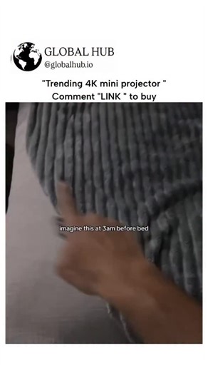 GLOBAL HUB on Instagram: "A short video clip with a square aspect ratio. In the video, a person uses a mini projector to show a landscape on a wall. At the beginning of the video, the text at the top reads "Trending 4K mini projector," "Comment 'LINK' to buy," and the logo for GLOBAL REEL HUB at the top left. The caption "imagine this at 3 am before bed" is at the bottom. A person's hand is shown using a remote to turn on a mini projector on a white wall. The projector displays a landscape with