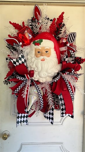 35K views · 904 reactions | ✨ Add a touch of vintage charm to your holiday décor! This bold Santa Face Christmas wreath is full of sparkle, ribbons, and festive cheer. Perfect for welcoming guests and making your front door shine all season long. ❤️懶 #SantaWreath #ChristmasFrontDoor #HolidayDecor #FarmhouseChristmas #DesignsByJordanTX | Designs by Jordan | Facebook
