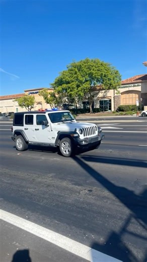 White Jeep Wrangler With Police Lights And A Siren Responding to A Crash in Roseville