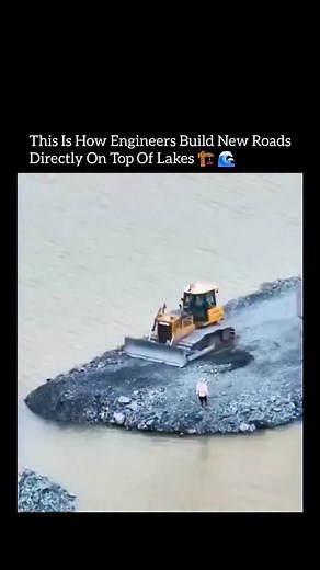 Insidee Out on Instagram: "This is how engineers create real, driveable roads in places where there was never land at all. 🌎⚙️ The process starts by dumping massive volumes of rock and aggregate directly into the water, forming a stable base that displaces soft sediment and spreads weight evenly across the lakebed. Heavy machinery then compacts each layer, forcing water out and locking the stones together through friction and pressure. Once the base reaches the surface, engineers add graded lay