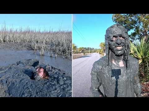 Sinking and submerging in mud and taking a selfie covered in mud