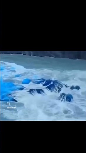 Massive Iceberg Flip Reveals Stunning Sapphire Blue Core