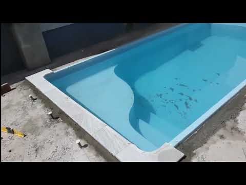 como assentar borda de pedra em piscina de fibra