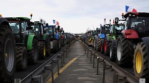 French farmers close in on Paris as government struggles to calm protests