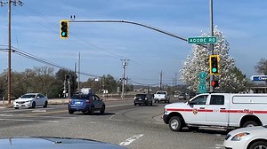 Caltrans is installing reflective backplates at more than 5,500 signalized intersections across the state. These retroreflective bordered backplates – yellow reflective strips placed around the perimeter of traffic signals – increase traffic signal visibility during morning hours, at night, or during a loss of power. | Caltrans HQ