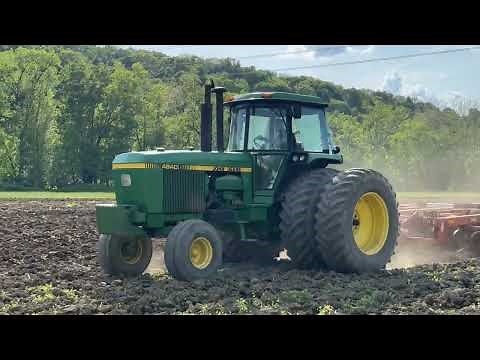 John Deere 4840 discing a corn field