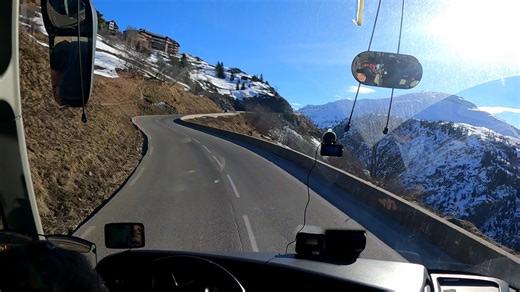 The ascent (with a coach full of winter sports enthusiasts) of the Alpe D'Huez with a beautiful view along the way!. | Bus Travelin'Man