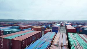 Busy shipping yard filled colorful cargo containers background. Loading, unloading boxes. Forklift logistics, transportation industry, global trade. Camera move dock. Supply chain management.