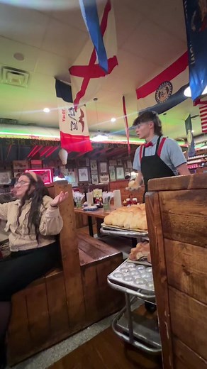 Enjoying Giant Rolls at Lambert's Cafe in Missouri
