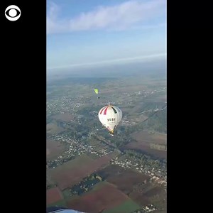 BALLOON SURFING: French man Remi Ouvrard has completed a new and unusual world record — standing on top of a hot air balloon 13,175 feet in the sky. | CBS News