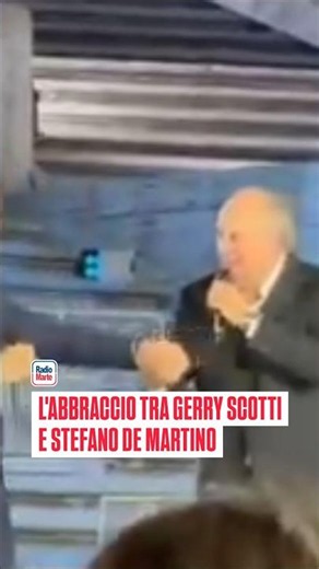 Gerry Scotti and Stefano De Martino hug at the Spanish Steps