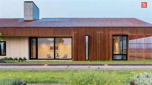 Modern corten steel barn with an asymmetrical roof