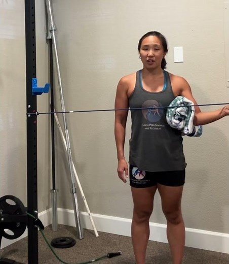 Standing shoulder external rotation with a band